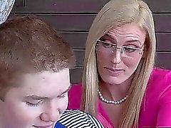 Stepmom MILF teaches boy how to lick her