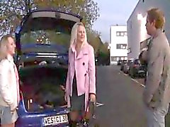 Two German teens are in a parking lot in public eating cock