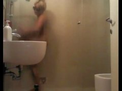 Big-titted blonde showering and getting blown