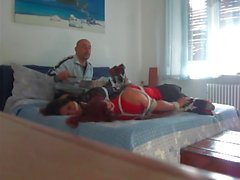 Hogtied slaves tortured on bed