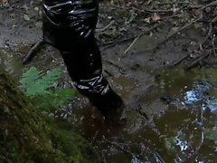 Vinyl mini skirt, thigh high boots in deep mud!