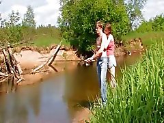 Young couple banging by the lake