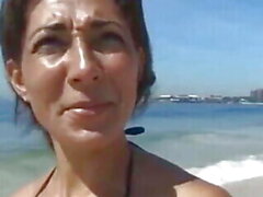 Tanned cougar was picked up on a public beach for kinky sex and a facial - Sunporno