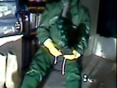 An old vid wanking in green rubber.