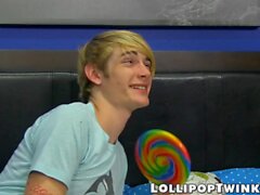 Horny twink Austin Tyler sucks on a thick cock and a lollipop