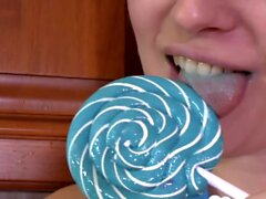 Hot MILF enjoys sucking on a lollipop